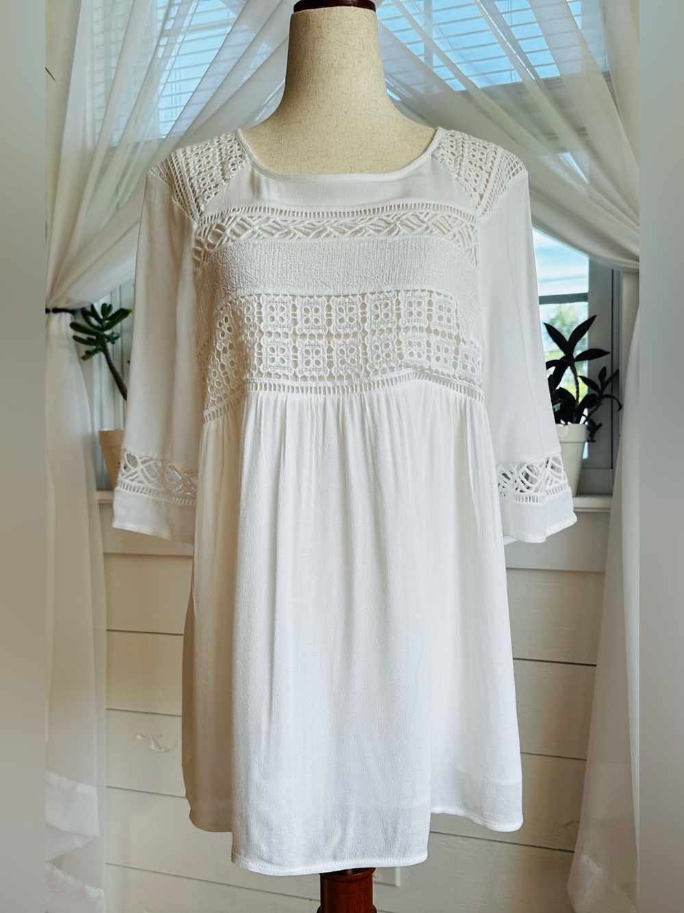Pale Sky White “Levana" Crochet lightweight, bohemian-style peasant blouse.